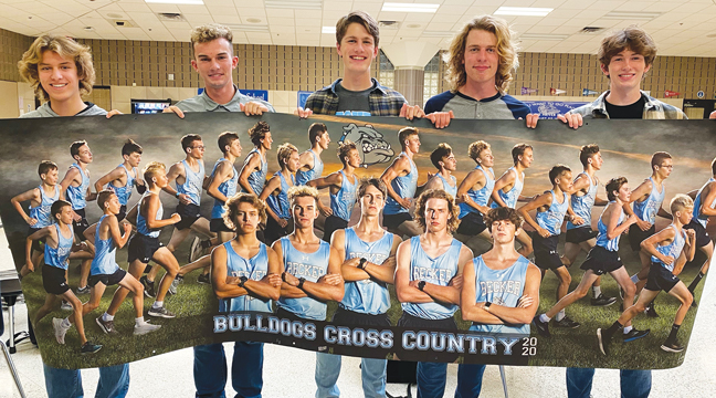 Bulldog Seniors hold the team banner for a quick photo opportunity. Left to right: Luke MacDonald, Cade Stommes, Wyatt Hiltner, Lukas Karel and Keegan Murphy. (Submitted Photo).