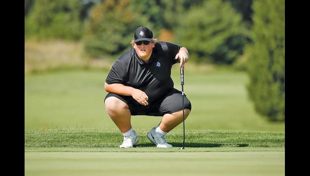 JACKSON FLUCK eyed up a putt during an earlier tournament in his career as a Spartan for Aurora University. (Submitted Photo).