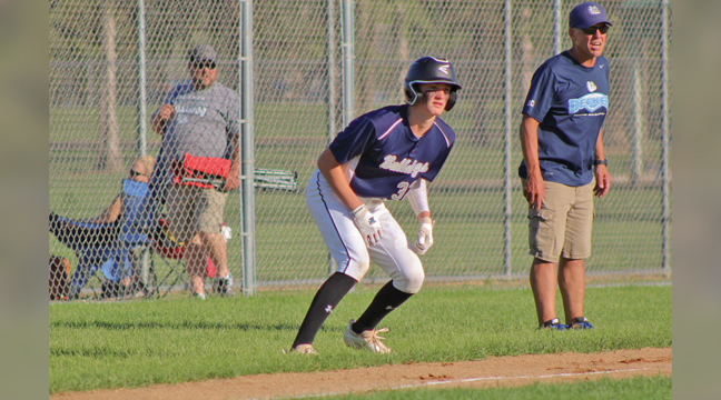 Becker’s Nolan Murphy leads off third base as he and coach Brian Kolbinger keep an eye on the opposing pitcher. The Becker 16U team defeated Blaine 13-10 on Monday evening. (Submitted photo). 