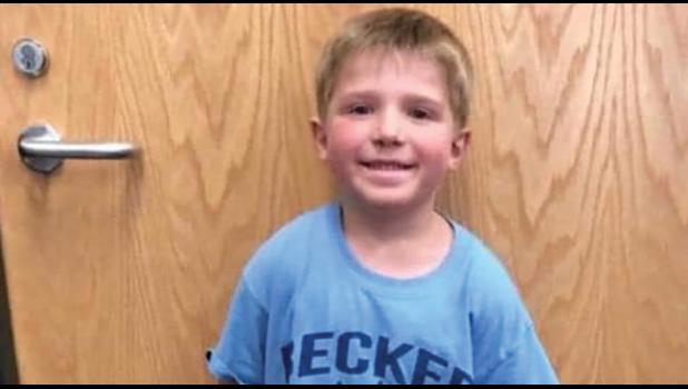 ETHAN HAUS, was last seen running off with his dog after jumping off the school bus in late October. Several hours later, Ethan and Remmie were located after a frantic search. (Photo from Facebook).
