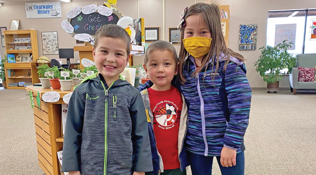 THE BONHARDT FAMILY, Elliott, Everett, and Natalie, stopped by the Clearwater Library to pick out their books after their name was drawn at the expo. (Submitted Photo)