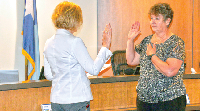LORAINE RUPP (R) was sworn-in Tuesday by County Recorder Michelle Ashe as the new Auditor-Treasurer with  Sherburne County. Rupp will fill the elected position of Diane Arnold, who will retire on July 9 of this year. (Submitted Photo).