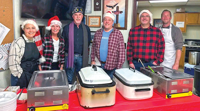 CHRISTMAS DINNER HELPERS WERE: (Left to right), Helen Swanson, Kelly Kolbinger, Benton-Sherburne American Legion Commander Bill Hannay, Mark Swanson, Mark Kolbinger, and Tim Swanson. (Submitted Photo).