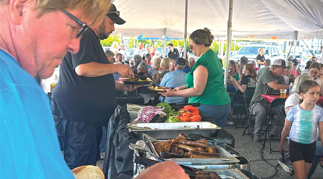 THE FREE FOOD AND BEVERAGES  drew in huge crowds during the event. (Photo by Penny Leuthard)