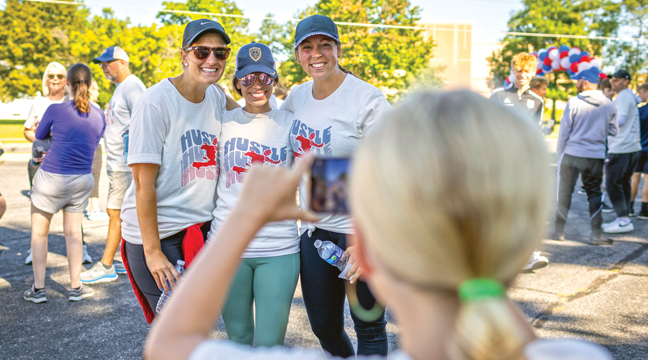 Participants Camie Ihrke, Kayla Dorweiler and Katie Ley posed for photos before hitting the course in the Haitian Hustle 5K in Becker. (Submitted Photo).