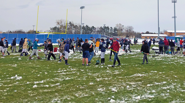 BECKER FOOTBALL PLAYERS grades 8-12 brought shovels to practice last Wednesday to clear the fields for practice and the eighth grade game played Thursday. (Submitted Photo).