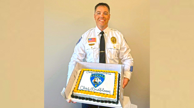 CHIEF LINDBLOOM with his cake after receiving his promotion. (Submitted Photo).