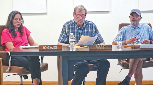 BIG LAKE TOWNSHIP TREASURER KEN WARNEKE (middle) explained the 2026 levy up for approval at the recent reconvened annual meeting. The levy will decrease by 0.52% from 2025. (Photo by Katherine Cantin.)