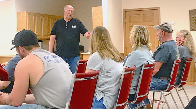 CLEARWATER TWP. CHAIRMAN John Notch listens to residents’ questions on the township’s upcoming road projects. (Photo by Penny Leuthard.)