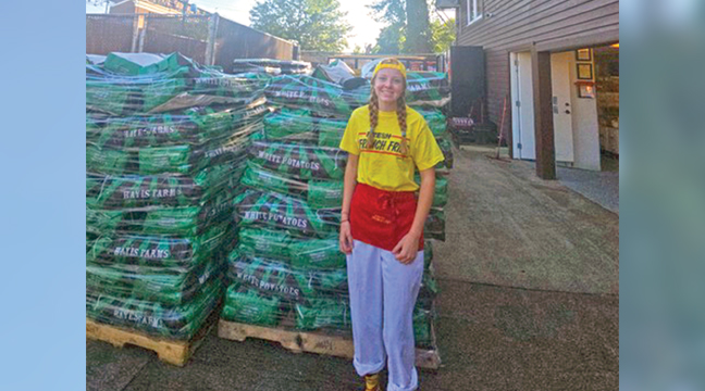 FRESH, HOT FRENCH FRIES. Hayes Farms, of Big Lake, provided a staggering amount of potatoes again this year at the Minnesota State Fair for Fresh French Fries - a vendor at the Minnesota State Fair known for its fresh-cut, gluten free fries. The Big Lake farm provides all the potatoes for the popular food booth. Inset photo: Grace Bugher is pictured near a pallet of Hayes potatoes on the state fairgrounds last week. (Patriot photos by Mary Nehring). 