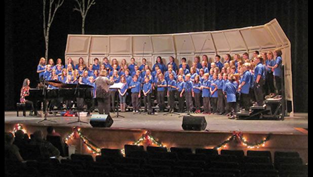 BECKER SIXTH GRADERS sing a holiday carol during their concert Thursday night. (Photo by Penny Leuthard)