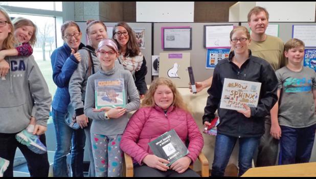 ESCAPE ROOM ADVENTURERS celebrate the successful completion of their “escape.” (Submitted Photo)