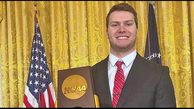 BEAU PAULYwas photographed with the championship trophy  by members of the media at Monday’s celebration. (Submitted Photo).