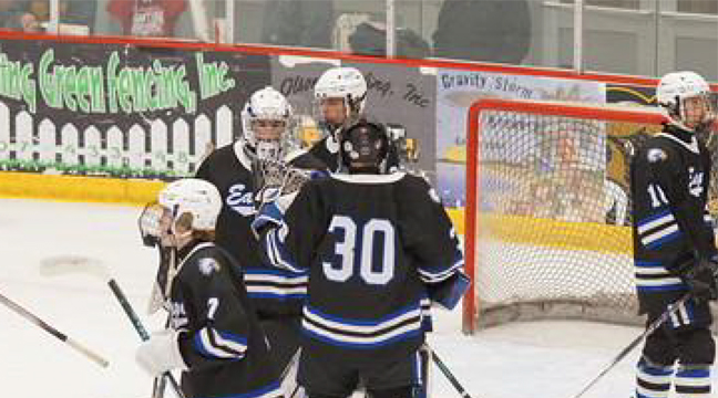 The Becker/Big Lake Eagles gathered around their goaltender after the final horn in last week’s loss to Austin. (Submitted Photo).