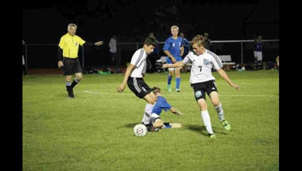 Max Rositas and Christian Hanowski fight for control of the ball and win.