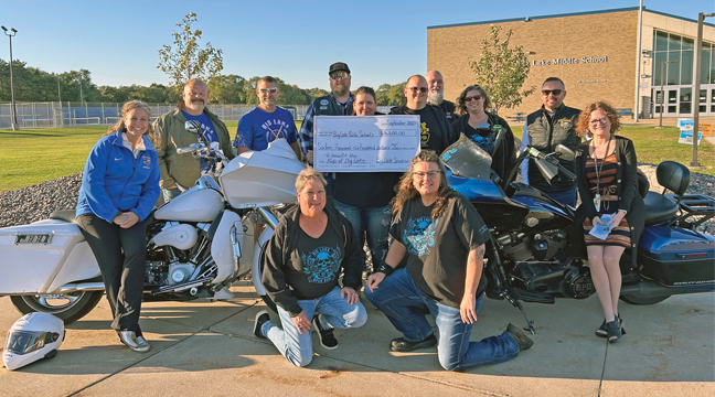 THE Big Lake Spud Run Motorcycle Rally Committee members posed along with school principals, trap team coaches and robotics instructors of the Big Lake Schools.  Pictured left to right is Teresa Smock-Potter, Jesse Hauan, Roy McMullen, Kyle Reischl, Jen Carter – Broske, Ben Lauderbaugh, Bob Dockendorf, Susan Stender, Mark Ernst, Jona Deavel.  Front Row:  Debbie Cosgriff and Dana Syverson. (Submitted Photo).
