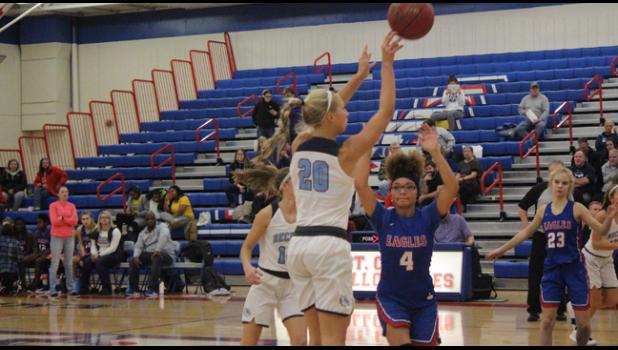 JULIA BENGTSON launches a long shot from the corner.