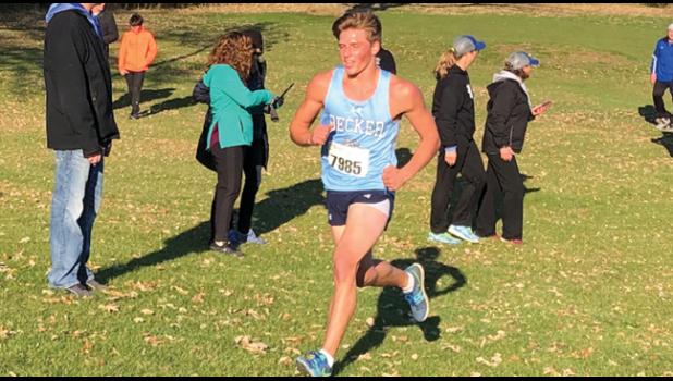 BULLDOGS CO-CAPTAIN JAKE NELSON finishes out his senior cross country season racing well and cheering on his teammates. (Submitted Photo)