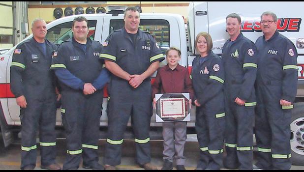 MEMBERS OF THE CLEAR LAKE FIRE DEPT. were on hand to thank A. J. Riservato for his help in saving his neighbor’s life last month. L to R: Asst. Chief Barry Schuldt, FF Harvey Doble, FF Matt Davis, A. J. Riservato, FF Kari Mechtel, Captain Chad Koren and Fire Chief Ron Koren. (Photos by Penny Leuthard)