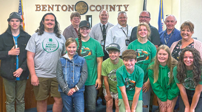 During the Benton County Board of Commissioners Meeting Benton County 4-H Extension Educator, Ann Olson, requested that the commissioners proclaim that Oct 5-11, 4-H Week in Benton County and they did. Photo: Back Row (L-R) Commissioner Pam Benoit (District 5), Commissioner Steve Heinen (District 3), Commissioner Jared Gapinski (District 4), Commissioner Scott Johnson (District 1) and Commissioner Ed Popp (District 2). Middle Row (L-R) 4-H’er Robert Mersinger, 4-H’er Johnathan Mersinger, 4-H’er Ava Kolbinger, 4-H’er Eve McKay and 4-H Extension Educator Ann Olson. Front Row (L-R) 4-H’er Piper Kolbinger, 4-H’er Owen McKay, 4-H’er Luke McKay, 4-H’er Claudia Schlough and 4-H’er Ana McKay. (Submitted Photo).