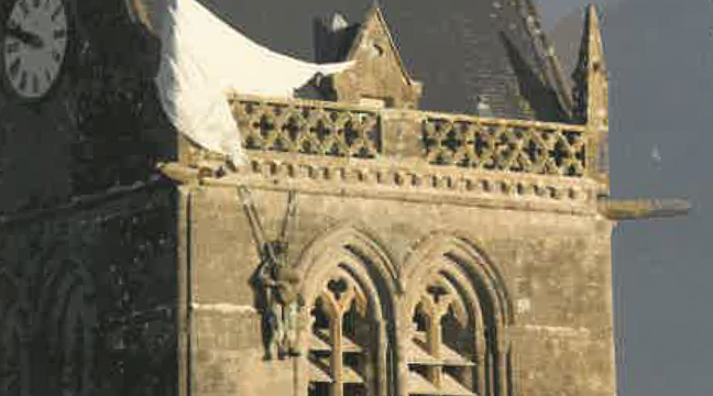 The American 82nd AB Division was paratrooping at night into St. Mere Eglise, just miles to the southwest. One of the troopers (left photo) became famous for his unfortunate landing, snagging his parachute rigging onto the steeple of the church, 90 feet above the parish yard. (Submitted Photo).