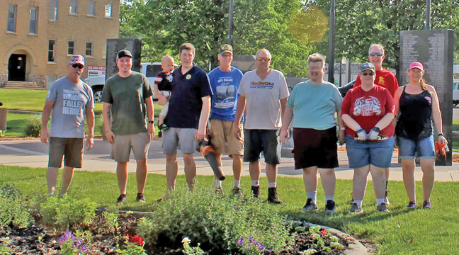 A GROUP OF BIG LAKE CITIZENS pitched in to help clean up the Veterans’ Memorial in Big Lake last weekend. From left to right were: Bruce Brown (Legion and Yellow Ribbon); Sam Hanson (City Council, Yellow Ribbon); Paul Seefeld (Legion Commander) with son Eli; Richard Wingard (Legion Adjutant); Cody Munger; Ketti Green (Yellow Ribbon); Bill Hannay (Legion and Yellow Ribbon); and Linda (Submitted photo.)