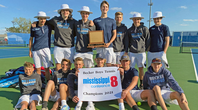 The Becker boys tennis team was all smiles after capturing the M8 Conference Championship Tuesday with a shutout win over Princeton.  Becker finished 7-0 in the conference this season (Submitted Photo).