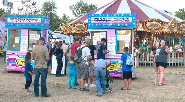 FAIR GOERS LINED UP FOR TICKETS to the Midway throughout the fair’s run. (Submitted photo.)